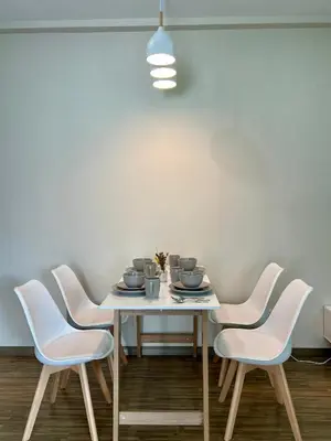a dining room with a table and four chairs at 30 OFF Monthly l 4Pax Designer Suite by CITYSPACE in Kuala Lumpur