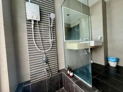 a bathroom with a shower and a sink and a mirror at 30 OFF Monthly l 4Pax Designer Suite by CITYSPACE in Kuala Lumpur