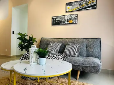 a living room with a couch and a table at MVB49#8pax Family Suite 3 Rooms Velocity Mall IKEA in Kuala Lumpur