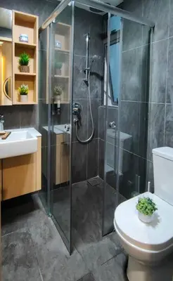 a bathroom with a shower and a toilet and a sink at CL24B 2-3pax KLCC Apartment in Kuala Lumpur