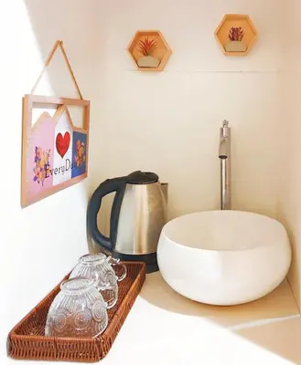 a bathroom counter with a sink and a coffee pot at CL24B 2-3pax KLCC Apartment in Kuala Lumpur