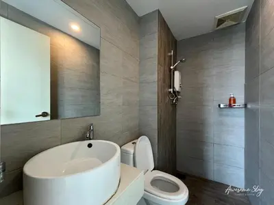 a bathroom with a white sink and a toilet at Arte plus by 3BR sweet home in Kuala Lumpur