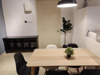 a dining room with a wooden table and chairs at Arte plus by 3BR sweet home in Kuala Lumpur