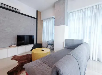 a bedroom with a bed and a flat screen tv at Arte plus by 3BR sweet home in Kuala Lumpur