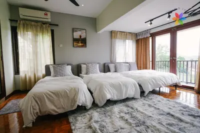 a bedroom with three beds in a room at 40P, Bangsar Villa with Pool/Karaoke/Gathering/BBQ in Kuala Lumpur