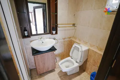 a bathroom with a sink and a toilet at 40P, Bangsar Villa with Pool/Karaoke/Gathering/BBQ in Kuala Lumpur