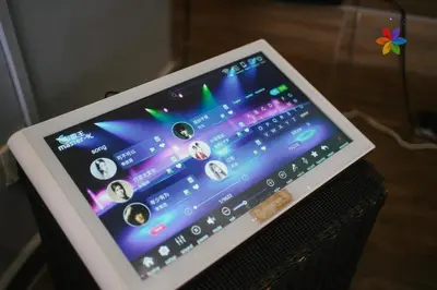 a tablet computer sitting on top of a speaker at 40P, Bangsar Villa with Pool/Karaoke/Gathering/BBQ in Kuala Lumpur