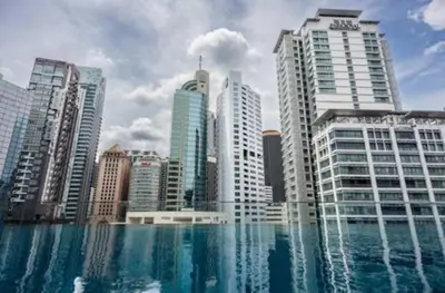 a view of a city with tall buildings and water at Bintang Suites Kuala Lumpur City Centre in Kuala Lumpur