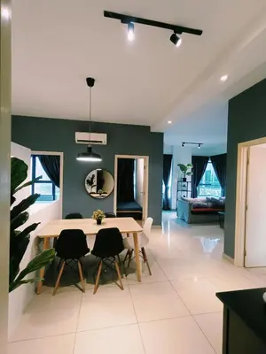 a dining room with a table and chairs at Arte Plus by Stay Relax in Kuala Lumpur