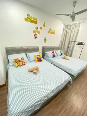 two twin beds in a bedroom with toys on them at SuperMCozy@Setapak Central Mall 10Pax 3BR 2CarPark in Kuala Lumpur