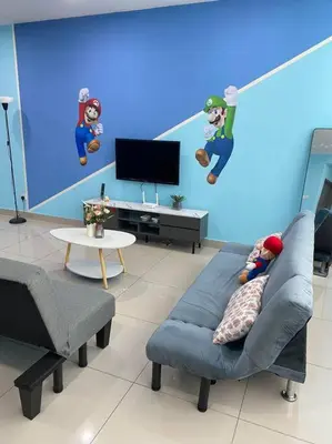 a person laying on a couch in a living room at SuperMCozy@Setapak Central Mall 10Pax 3BR 2CarPark in Kuala Lumpur