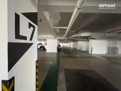 an empty parking garage with a car parked in it at Trion @ KL by Airhost in Kuala Lumpur