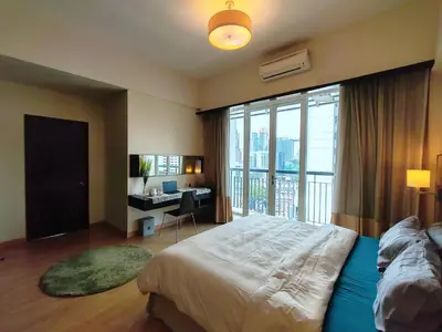 a bedroom with a bed and a desk with a window at 9 Bukit Bintang 5 minutes to Alor Street Seri Bukit Ceylon 2R2B 8 pax in Kuala Lumpur