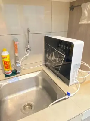 a microwave sitting on top of a kitchen sink at CozyVista Setapak Central Mall 10Pax 3BR 2CarPark in Kuala Lumpur