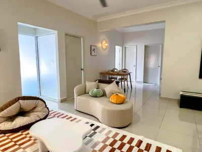 a living room with a couch and a table at VintageHome Lalaport Casa Mutiara Bukit Bintang by Scape Stay in Kuala Lumpur