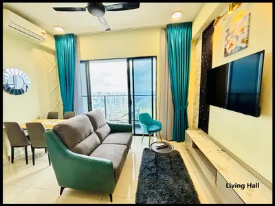 a living room with a couch and a television at Skystays360 KL, 60th floor - close to KLCC TRX 2-bedroom 2 bathrooms in Kuala Lumpur