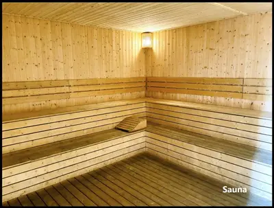 a wooden sauna with a light on the inside at Skystays360 KL, 60th floor - close to KLCC TRX 2-bedroom 2 bathrooms in Kuala Lumpur
