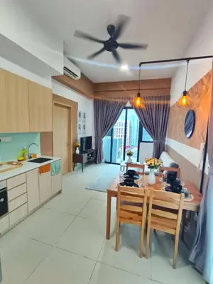 a kitchen with a table and a ceiling fan at Luxe Suites Home KLCC in Kuala Lumpur