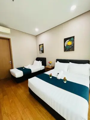a hotel room with two beds in a room at Soho Star Suites near by Klcc in Kuala Lumpur