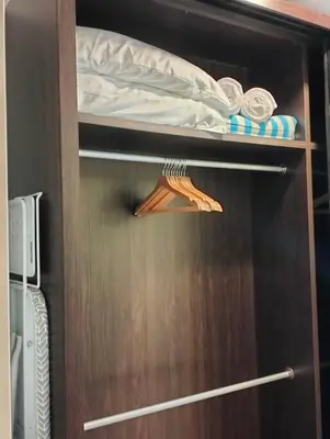 a wooden door with a bed on top of it at MH Homestay 3R2B Condo very near to KLCC, Free Wi-Fi, Netflix & Parking in Kuala Lumpur