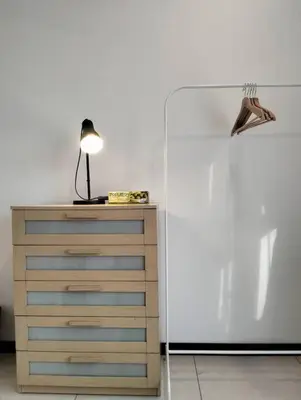 a lamp on a dresser next to a dresser at MH Homestay 3R2B Condo very near to KLCC, Free Wi-Fi, Netflix & Parking in Kuala Lumpur