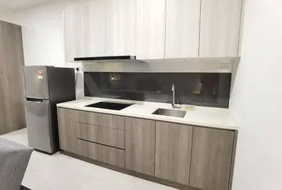 a kitchen with a sink and a refrigerator at Modern Comfy Studio Permaisuri 2 Carpark WIFI in Kuala Lumpur