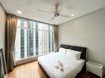 a bedroom with a bed with a teddy bear on it at 450m from Aquaria KLCC/KL ConventionCtre, 2 Beds#2 in Kuala Lumpur