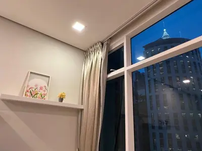 a window with a view of a tall building at 450m from Aquaria KLCC/KL ConventionCtre, 2 Beds#2 in Kuala Lumpur