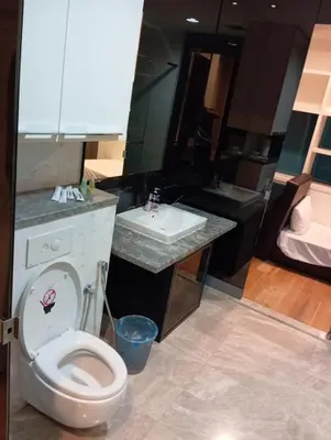 a bathroom with a toilet and a sink at Platinum suites klcc by Fifty One in Kuala Lumpur