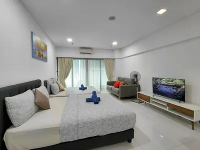 a living room with a large bed and a couch at KLCC Summer Suite#3, Monorail, 4Pax in Kuala Lumpur
