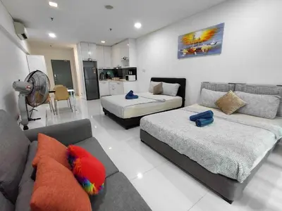 a living room with two beds and a couch at KLCC Summer Suite#3, Monorail, 4Pax in Kuala Lumpur