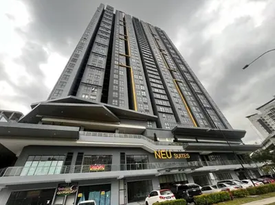 a tall building with cars parked in front of it at Neu Suite Ampang, LRT Jelatek, Gleneagles Hospital in Kuala Lumpur