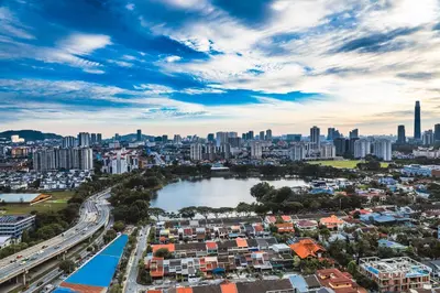 an aerial view of a city with a river and buildings at M CITY Near KLCC KPJ Puteri Specialist Hospital in Kuala Lumpur