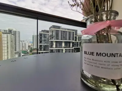 a vase filled with flowers sitting on a window sill at Arcoris Mont Kiara 15# 163 Sunway Mall # 1 Mont Kiara in Kuala Lumpur
