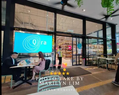 a group of people sitting at a table in front of a store at Arcoris Mont Kiara 15# 163 Sunway Mall # 1 Mont Kiara in Kuala Lumpur