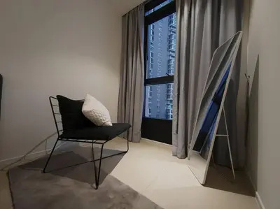 a black chair in a room with a window at Arcoris Mont Kiara 18# Sunway 163 Mall# 1 Mont Kiara # 2 BR with Balcony 2-4 Pax in Kuala Lumpur
