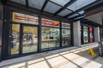 a store front of a grocery store with glass windows at Arcoris Mont Kiara 18# Sunway 163 Mall# 1 Mont Kiara # 2 BR with Balcony 2-4 Pax in Kuala Lumpur