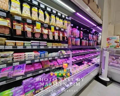 a store aisle filled with different types of food at Arcoris Mont Kiara 18# Sunway 163 Mall# 1 Mont Kiara # 2 BR with Balcony 2-4 Pax in Kuala Lumpur