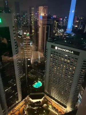 an aerial view of a shanghai building at night at Vortex KLCC (42) Amazing view in Kuala Lumpur
