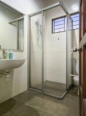 a bathroom with a shower and a sink and a toilet at KL Secret Karaoke Private Pool Villa in Ampang