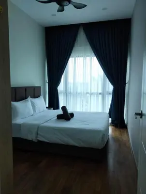 a bedroom with a bed with a large window at Reizz Residence By Sweet Home in Kuala Lumpur