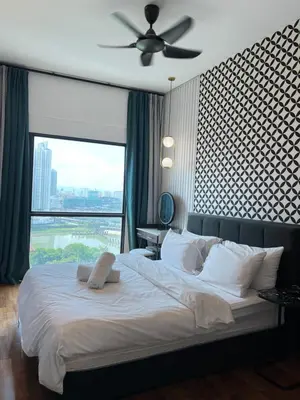 a bedroom with a large bed with a large window at Reizz Residence By Sweet Home in Kuala Lumpur