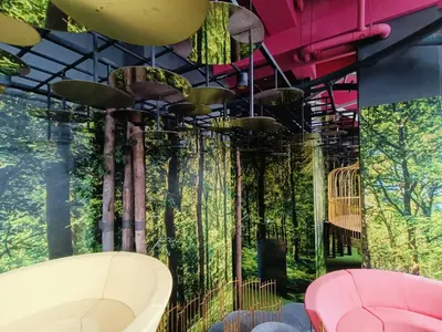 a room with a forest mural on the wall at Arte Plus by Stay Relax in Kuala Lumpur