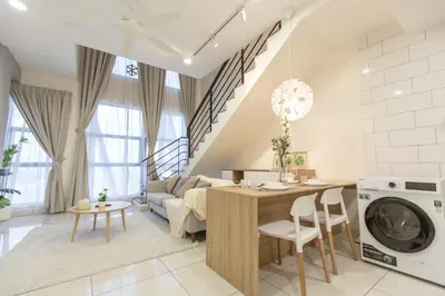 a kitchen and living room with a table and a couch at Arte Mont Kiara by MY TRIP & MY STAY in Kuala Lumpur