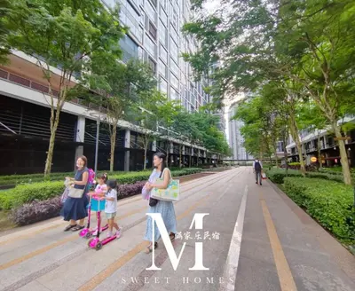 a group of people standing on scooters on a street at Arcoris Mont Kiara 2# Sunway 163# 2-Bedroom with balcony 2-4Pax in Kuala Lumpur