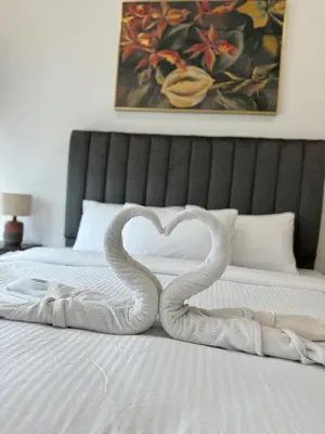 two snakes forming a heart on a bed at REIZZ RESIDENCE BY BERJAYA in Kuala Lumpur