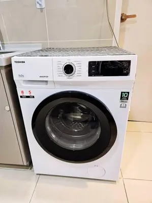 a white washing machine with a counter on top of it at Stunning Pool & the City - 1 mrt stop to TRX in Kuala Lumpur
