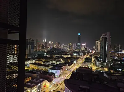 a city lit up at night with traffic at Stunning Pool & the City Studio- 1 Mrt stop to TRX in Kuala Lumpur