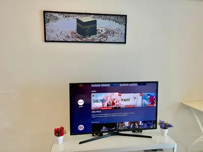 a computer monitor sitting on top of a desk at Summer Suites KLCC By Victorians in Kuala Lumpur