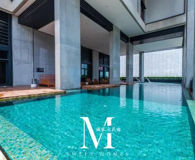 a swimming pool in the middle of a building at Mont Kiara Cozy 2 #2Bedroom with Balcony #Arcoris in Kuala Lumpur